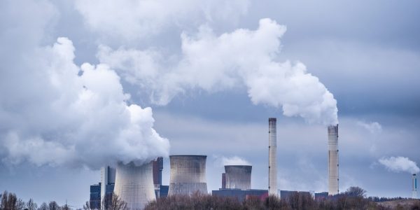 A wide angle shot of white smoke coming out of the nuclear plants